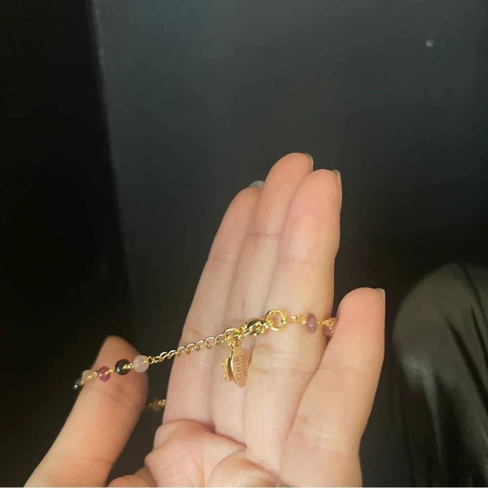 Gold tone crystal pink bird chain bead chain bracelet